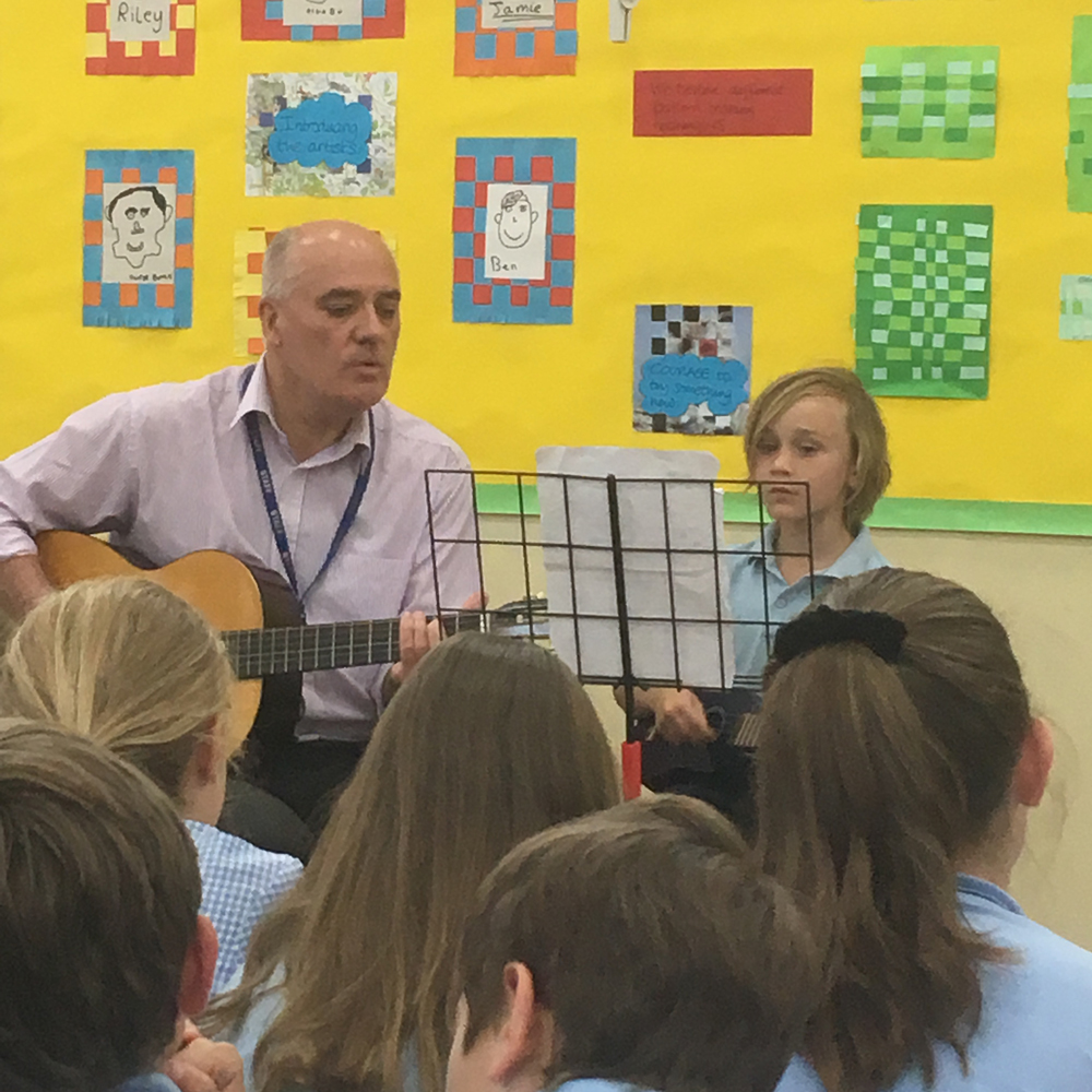 Jim Bateman teaching music class lessons